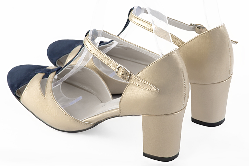Navy blue and gold women's T-strap open side shoes. Round toe. Medium block heels. Rear view - Florence KOOIJMAN